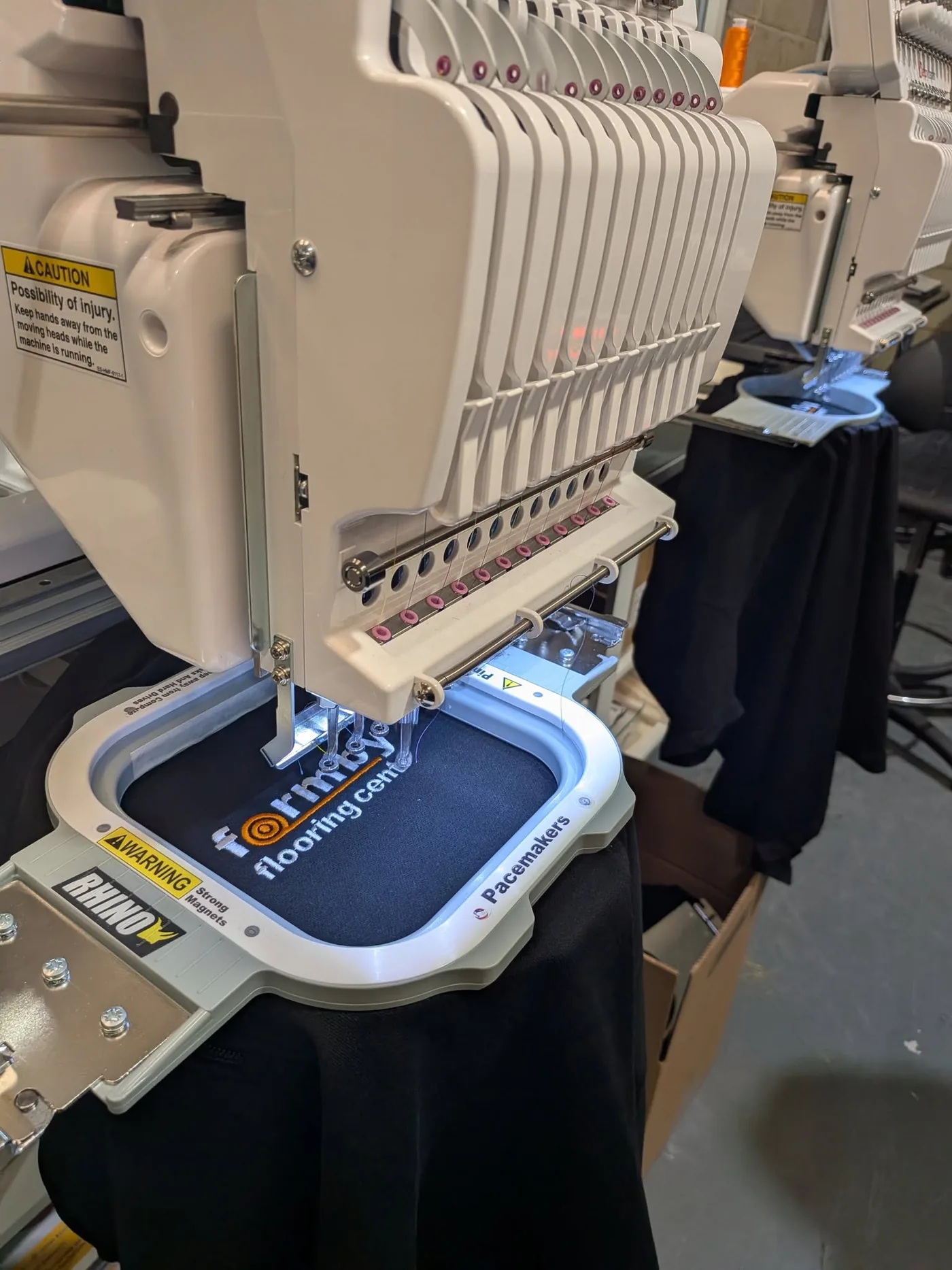 Southport Workwear embroidery machines applying a customer logo to workwear