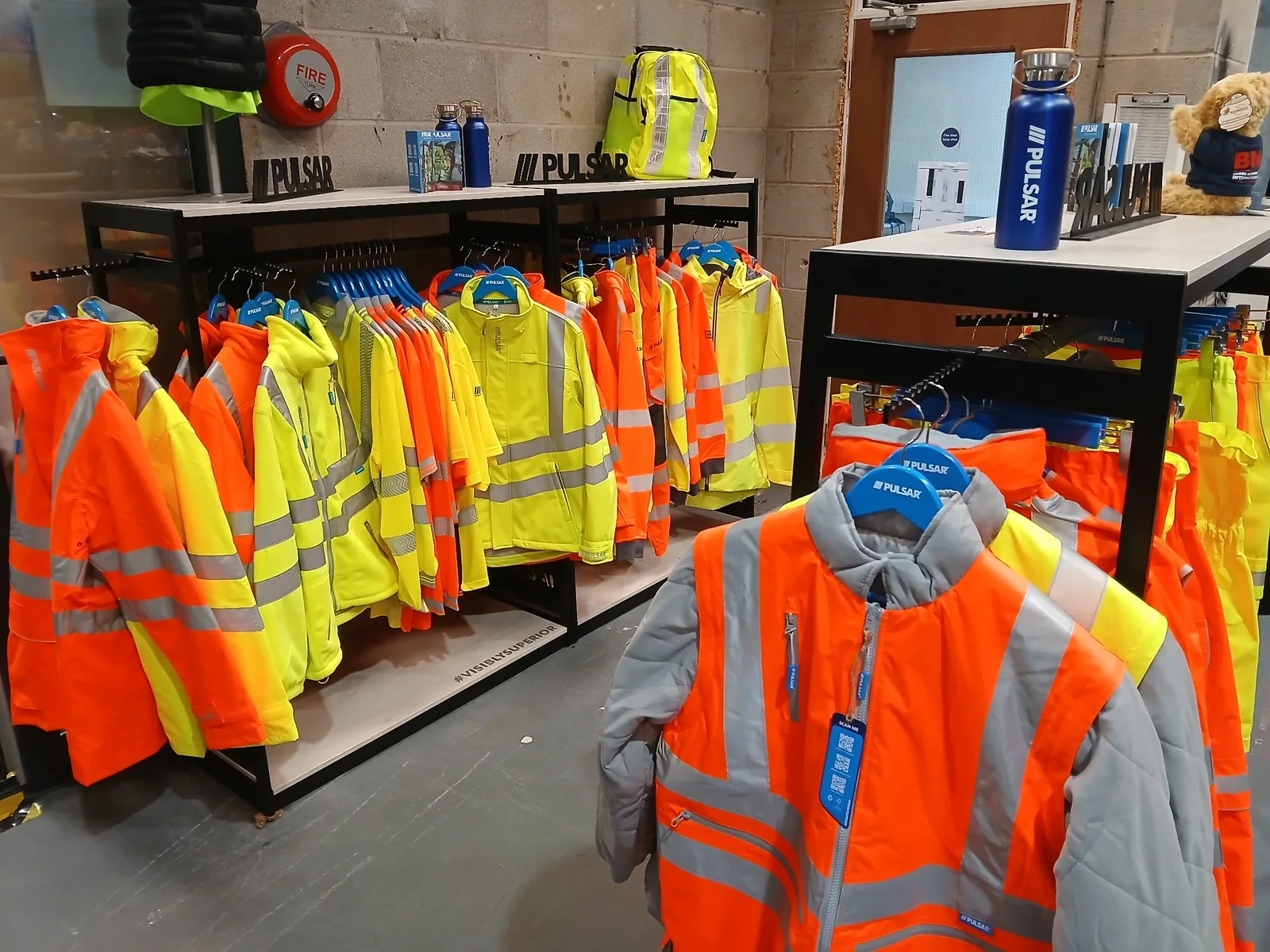 Pulsar yellow and orange hi-vis clothing displayed in the Southport Workwear showroom