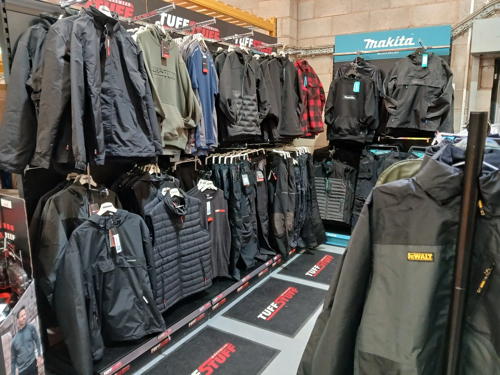 TuffStuff and Makita jackets, hoodies, gilets and trousers displayed in the Southport Workwear showroom